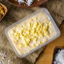 Load image into Gallery viewer, Maja Blanca is a popular Filipino dessert that is known for its creamy and coconut-flavored goodness. It is a type of rice cake or pudding made from coconut milk, cornstarch, and sugar.
