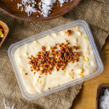 Load image into Gallery viewer, Maja Blanca is a popular Filipino dessert that is known for its creamy and coconut-flavored goodness. It is a type of rice cake or pudding made from coconut milk, cornstarch, and sugar.
