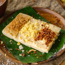Load image into Gallery viewer, Maja Blanca is a popular Filipino dessert that is known for its creamy and coconut-flavored goodness. It is a type of rice cake or pudding made from coconut milk, cornstarch, and sugar.
