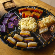 Load image into Gallery viewer, Indulge in a diverse selection of traditional Filipino delicacies with our Kakanin Platter. Featuring a variety of kakanin, this platter offers a taste of different flavors and textures. Perfect for sharing, celebrations and gift-giving ideas
